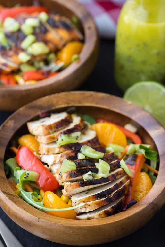 Sweet Heat Salad Recipe - Spicy and sweet meet for this dinner salad recipe! This Asian-inspired main dish is my take on the Swiss Chalet favorite with peppers, oranges, carrots, and a lime chili dressing.