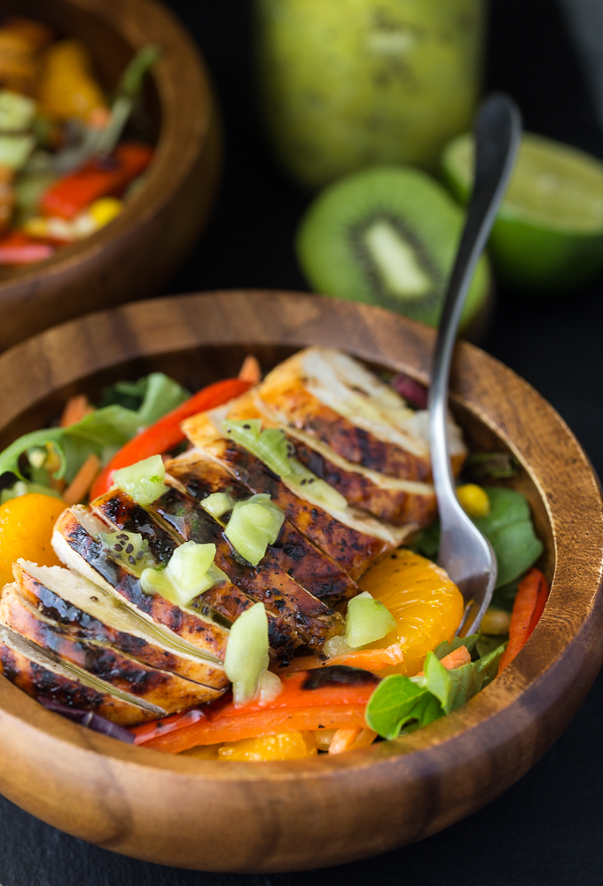 Sweet Heat Salad Recipe - Spicy and sweet meet for this dinner salad recipe! This Asian-inspired main dish is my take on the Swiss Chalet favorite with peppers, oranges, carrots, and a lime chili dressing.