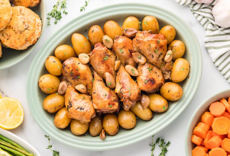 40 clove garlic chicken on a green platter.