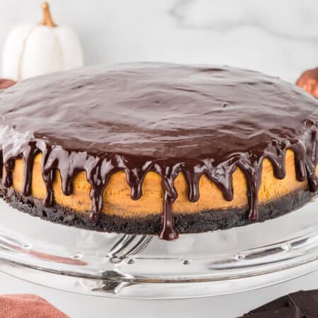 Chocolate pumpkin cheesecake on a platter.