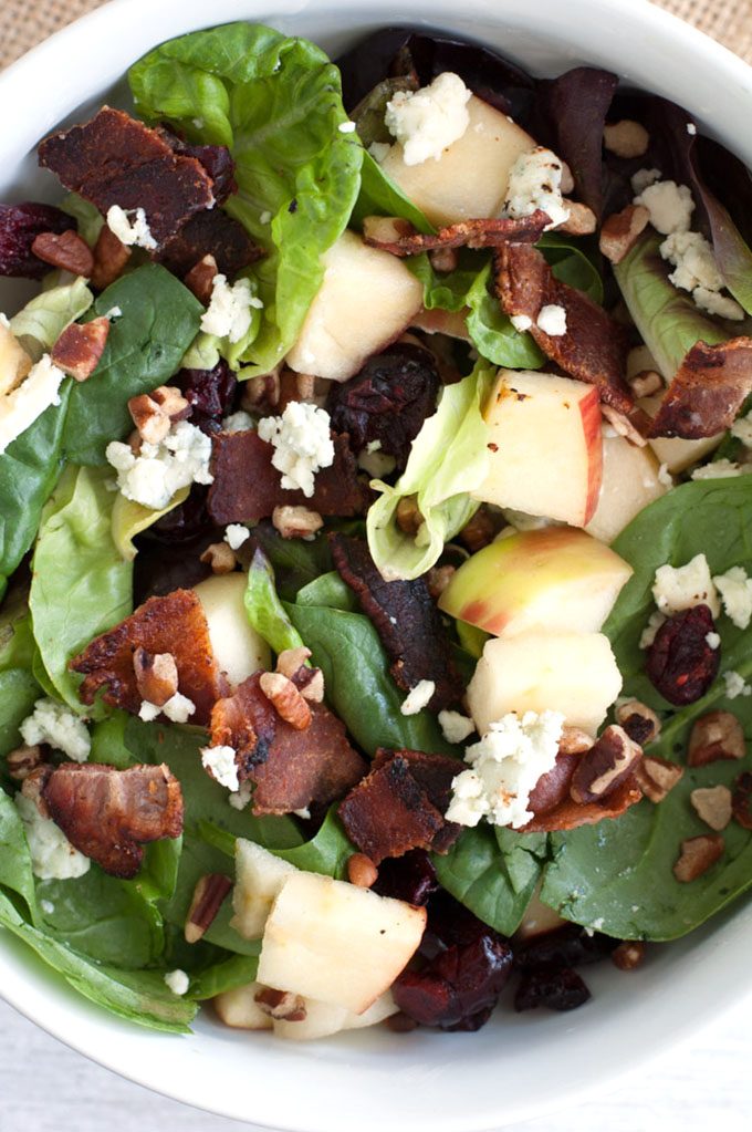 Fall Salad with Warm Bacon Vinaigrette - You'll love this hearty salad with its autumn flavors! It's packed full of goodness with Honeycrisp apples, pecans, dried cranberries, blue cheese and an oh so tasty warm bacon vinaigrette dressing.