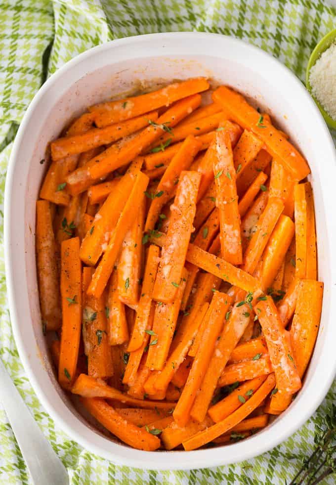Parmesan Roasted Carrots - Tender and perfectly roasted carrots topped with fresh thyme and melted Parmesan cheese. So tasty!
