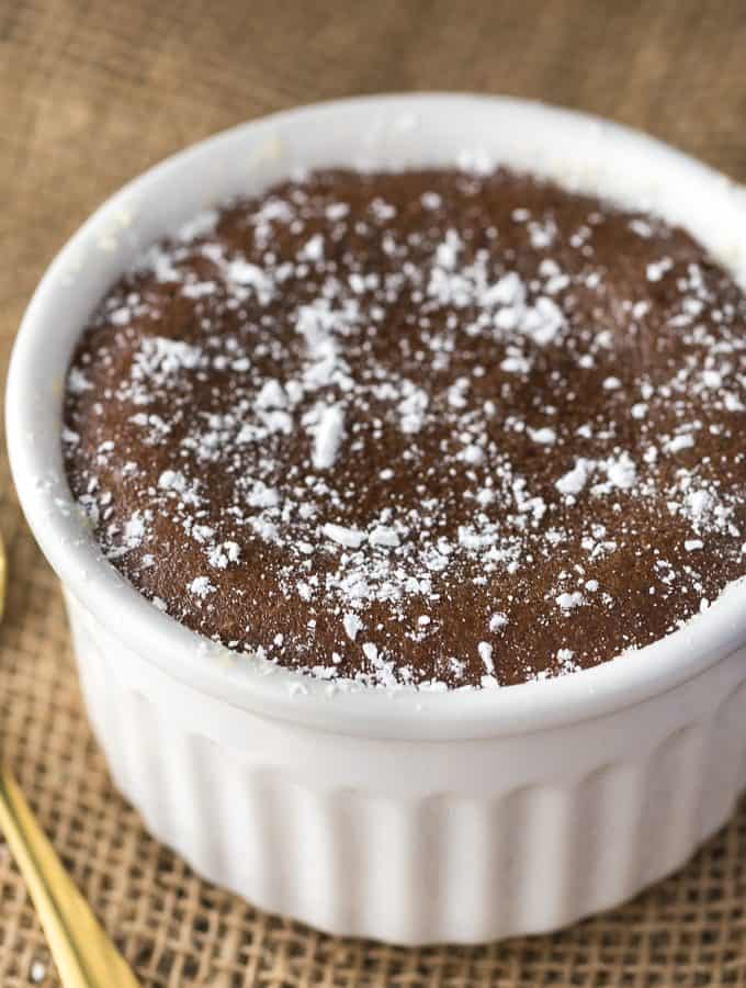 Reese Lava Cake - Decadent dessert alert! This sinfully rich chocolate cake is filled with gooey peanut butter goodness.