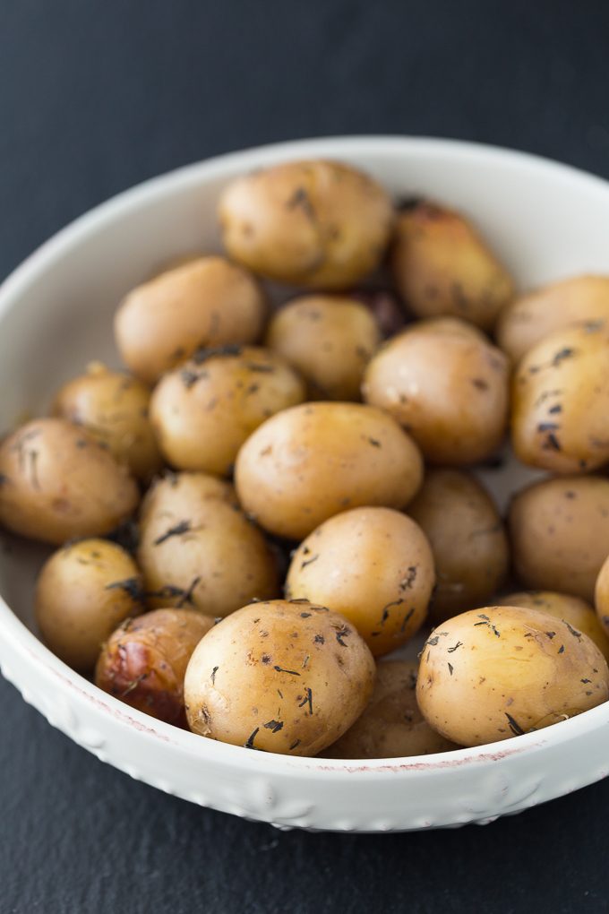 Savory Slow Cooker Potatoes - The easiest Crockpot side dish! You only need 5 ingredients to make the most tender potatoes filled with savory garlic flavor.