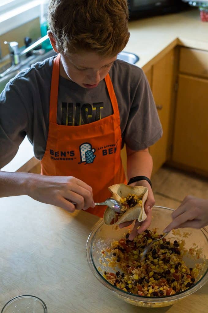 Black Bean & Rice Open-Faced Tacos - Kids love to help make this recipe of yummy tortilla bowls filled with flavourful Mexican rice.