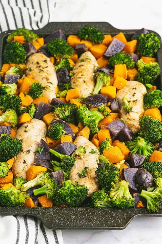 One-Pan Maple Dijon Chicken - This one-pan meal is perfect for those busy weeknights. You'll love the tender chicken baked with butternut squash, purple potatoes and broccoli roasted to perfection.