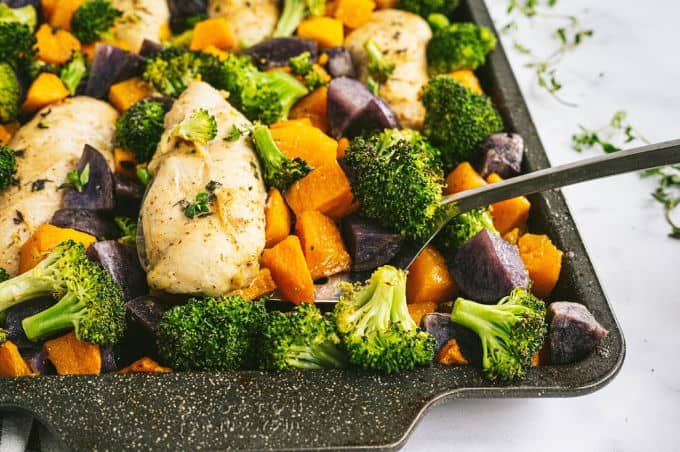 One-Pan Maple Dijon Chicken - This one-pan meal is perfect for those busy weeknights. You'll love the tender chicken baked with butternut squash, purple potatoes and broccoli roasted to perfection.