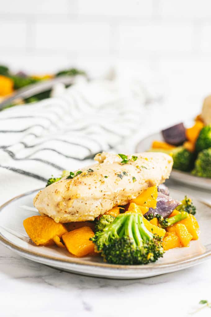 One-Pan Maple Dijon Chicken - This one-pan meal is perfect for those busy weeknights. You'll love the tender chicken baked with butternut squash, purple potatoes and broccoli roasted to perfection.