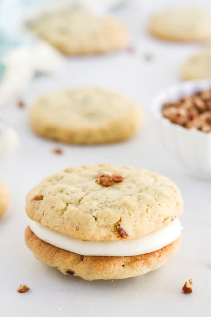 Pecan Cookies with Cream Cheese Filling - Think sugar cookies with a decadent nutty flavour and rich, smooth cream cheese frosting.