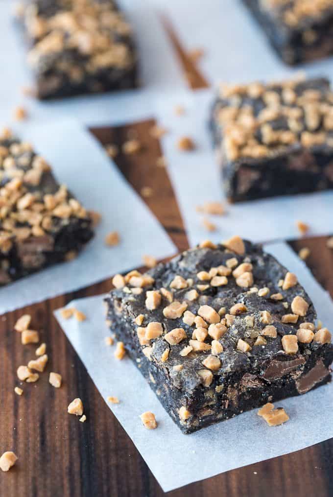 Chocolate Chewy Bars - Four-ingredient dessert! This delicious and decadent dessert is filled with Oreo crumbs, condensed milk, chocolate chips and toffee.