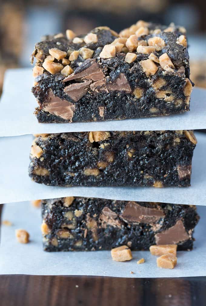 Chocolate Chewy Bars - Four-ingredient dessert! This delicious and decadent dessert is filled with Oreo crumbs, condensed milk, chocolate chips and toffee.