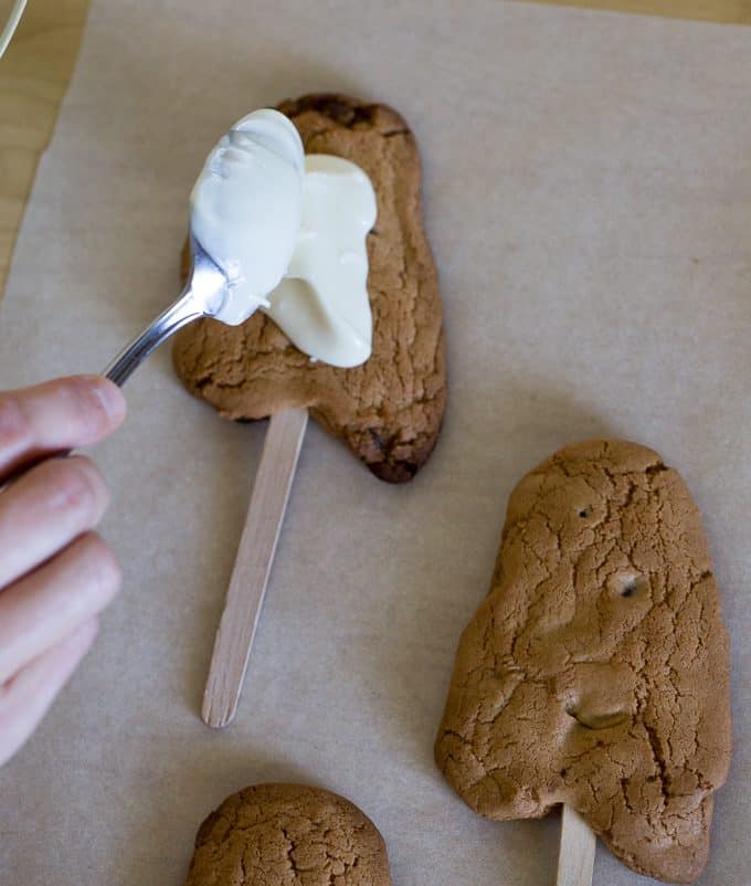 Ghost Cookies on a Stick - Spooky treats that are easy to make and fun to eat!