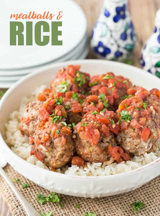 Meatballs & Rice - These simple beef meatballs are served with a spiced tomato sauce over a bed of rice. There's rice in the meatballs too for the fluffiest texture!