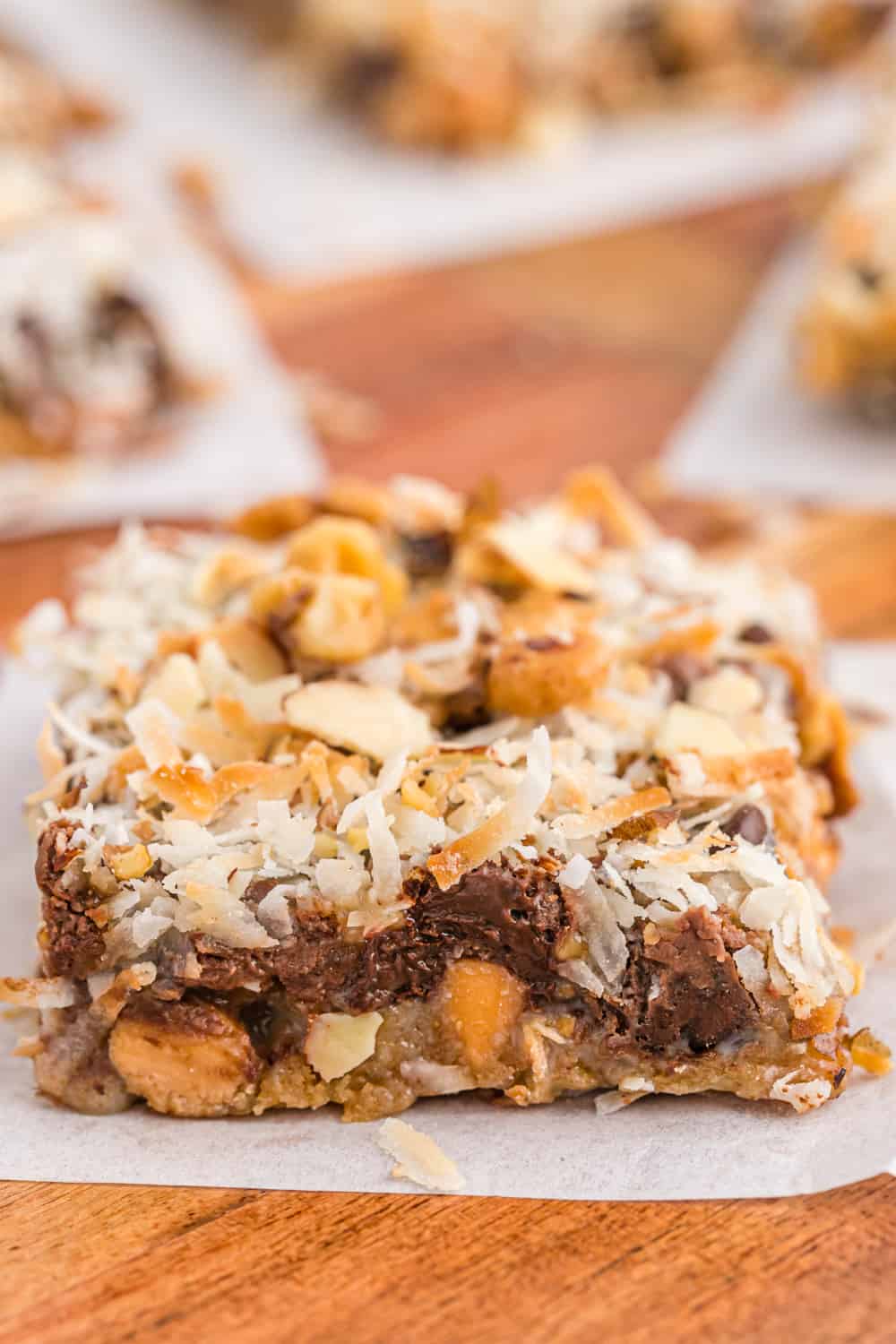 magic cookie bar on a piece of parchment paper