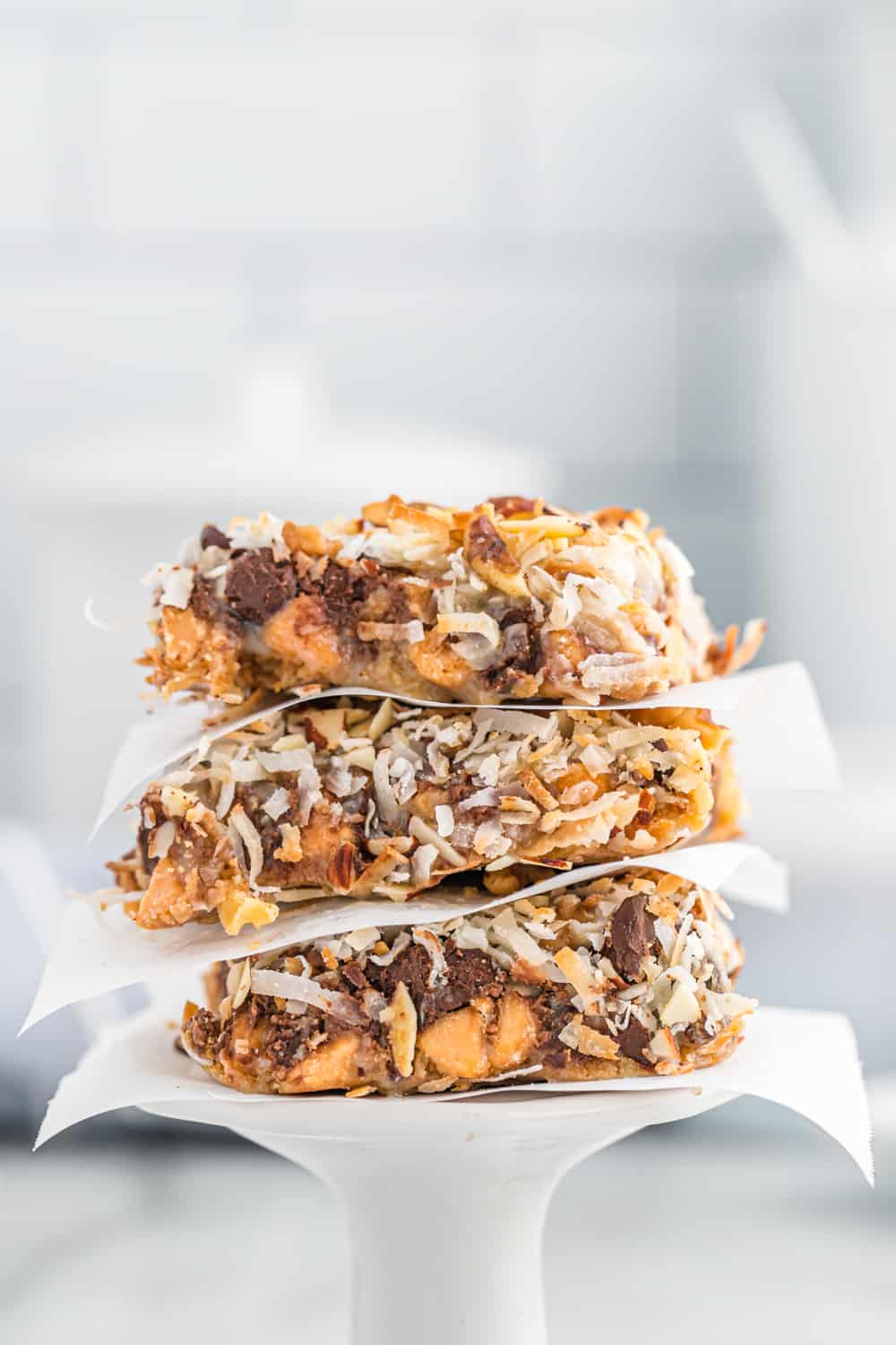 a stack of three magic cookie bars