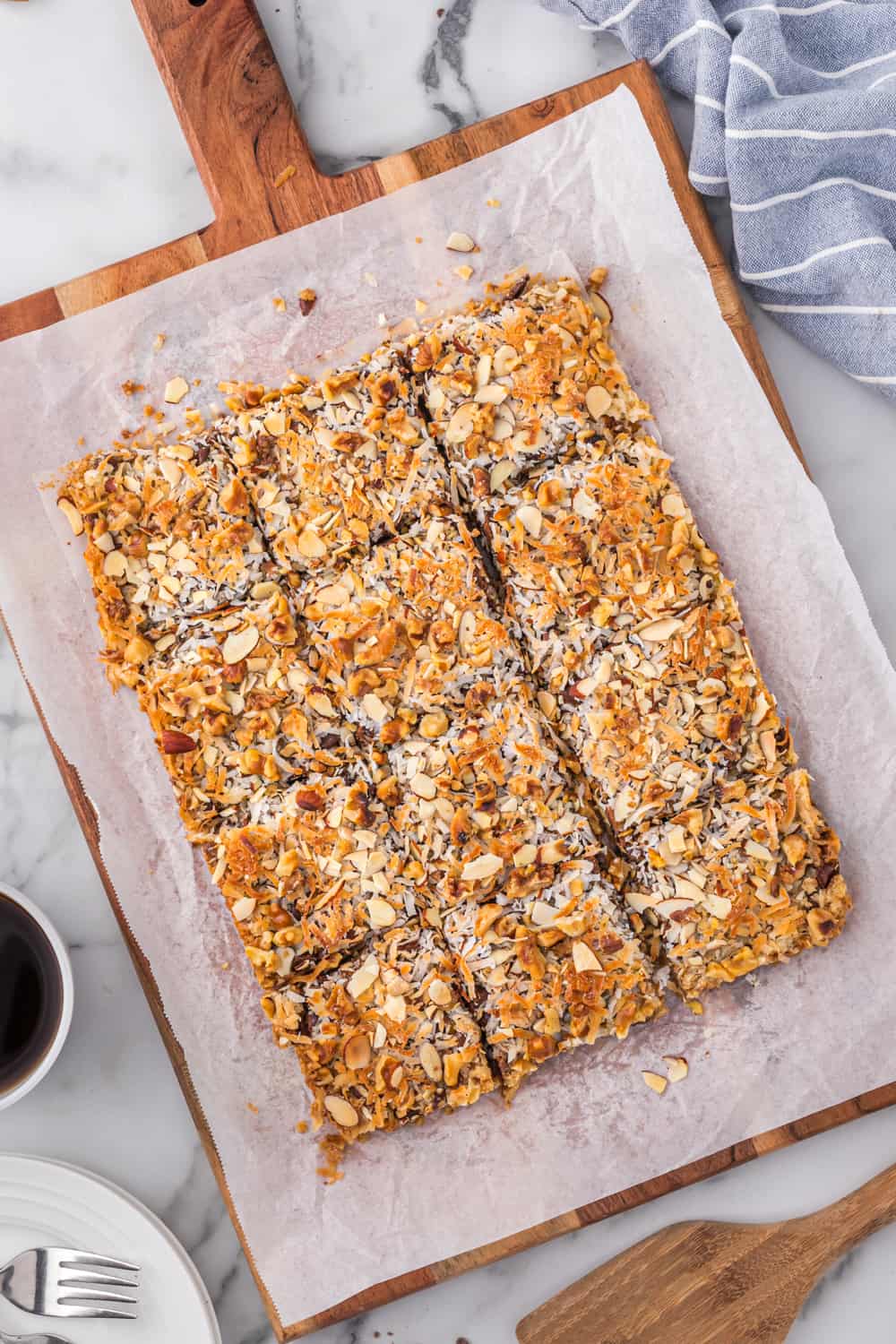 magic cookie bars on a cutting board cut into pieces