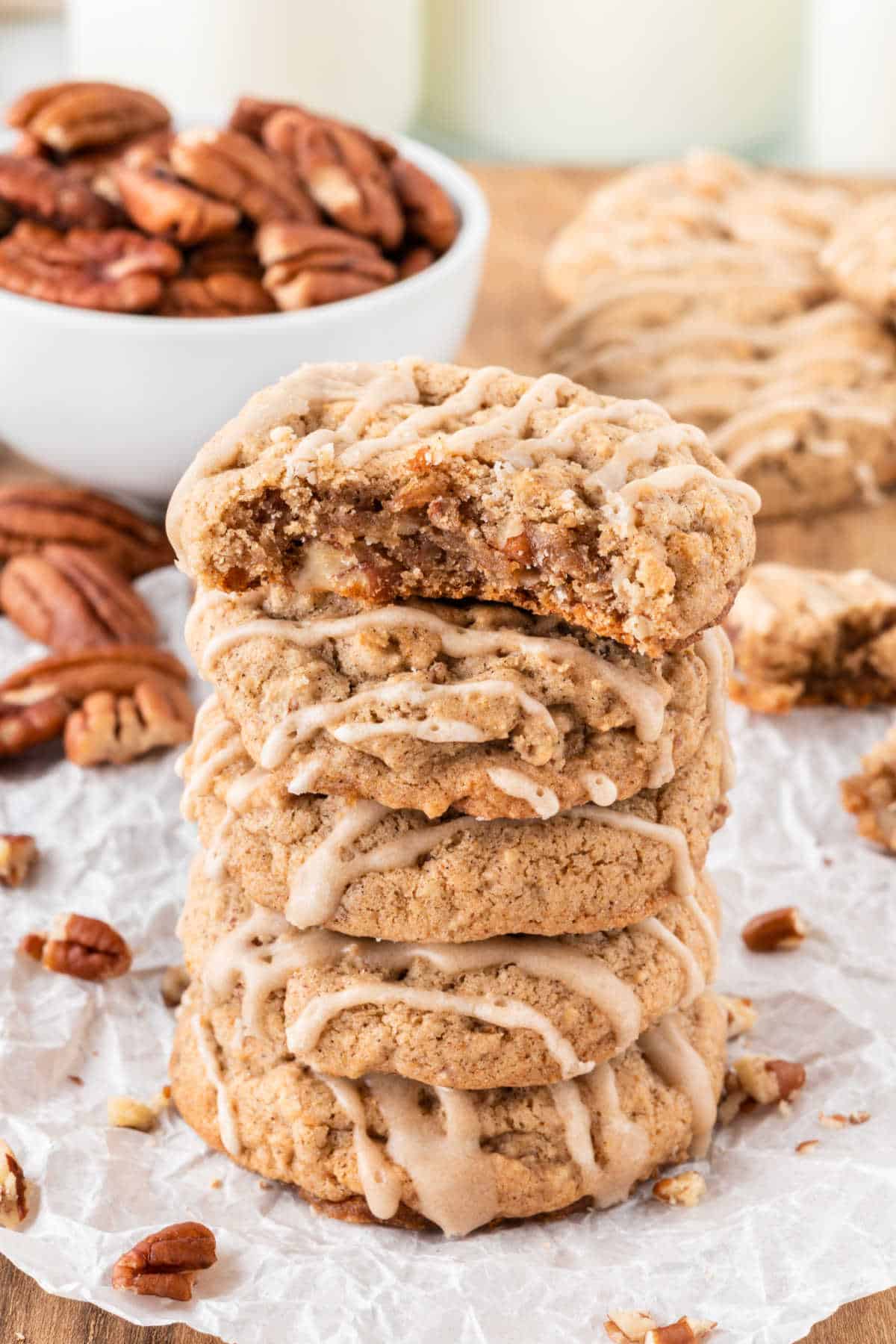 Brown sugar cookies stacked with a bite out of the top cookie.