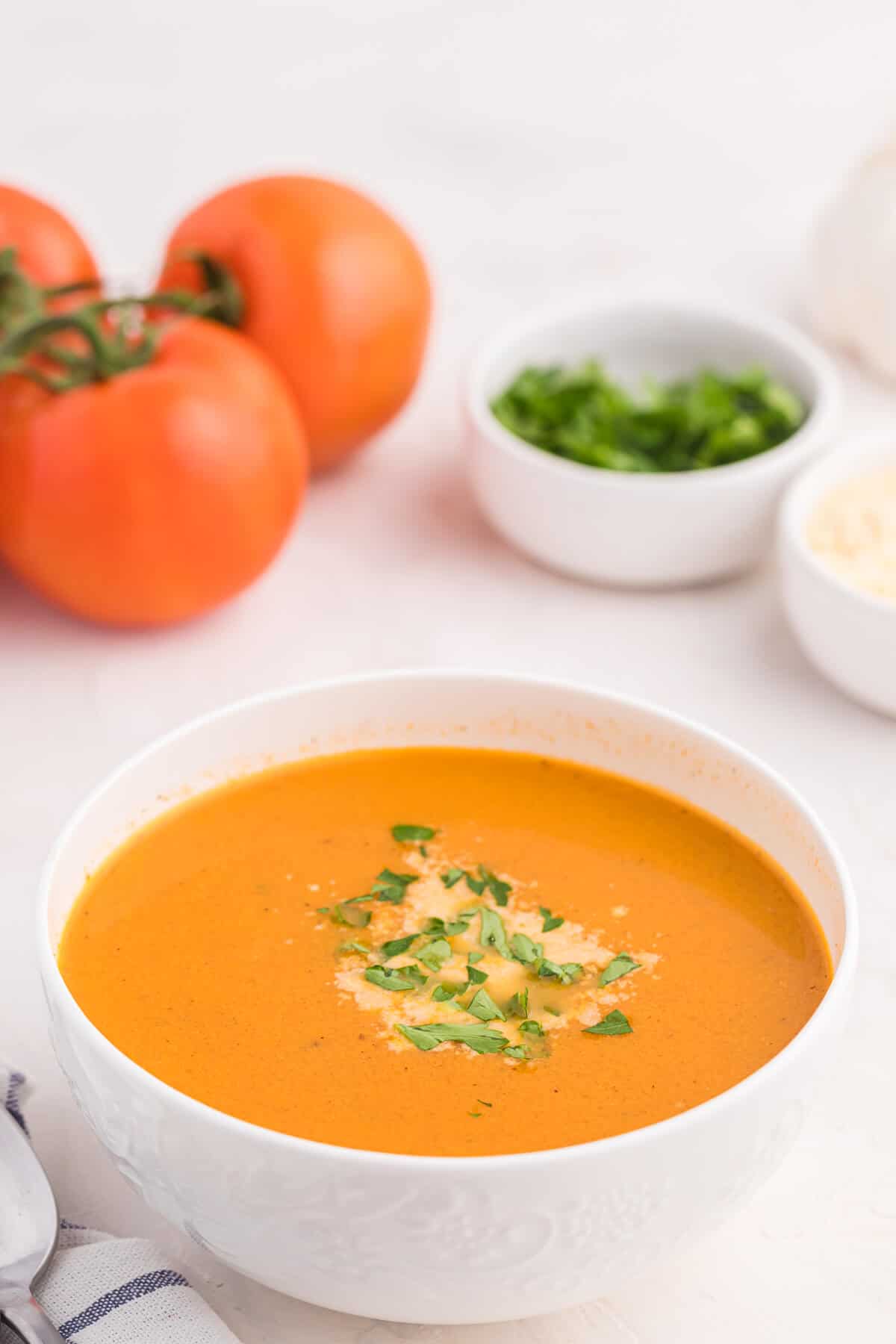 A bowl of roasted garlic and tomato soup.