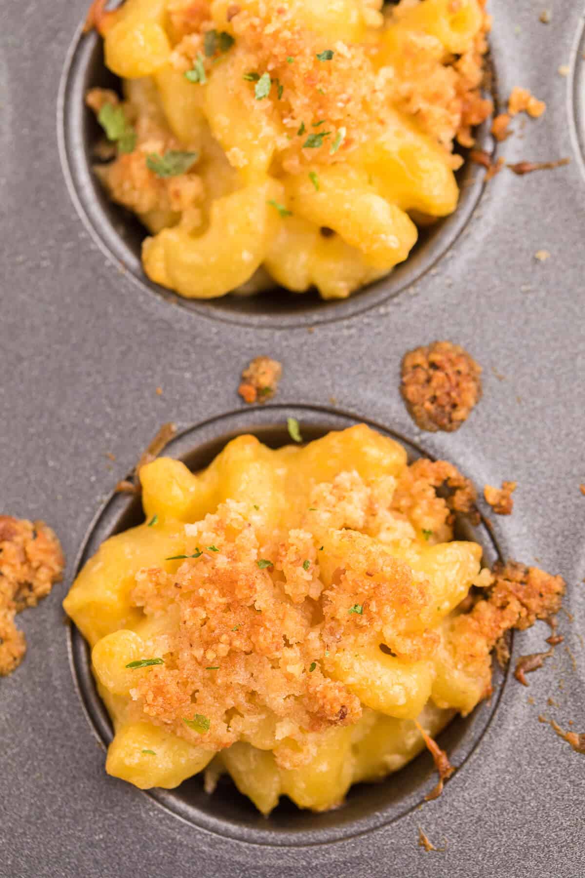 Mac and Cheese Cups - Comfort food in a cup! The perfect cozy, cheesy side dish, but handheld for appetizers and tailgating.