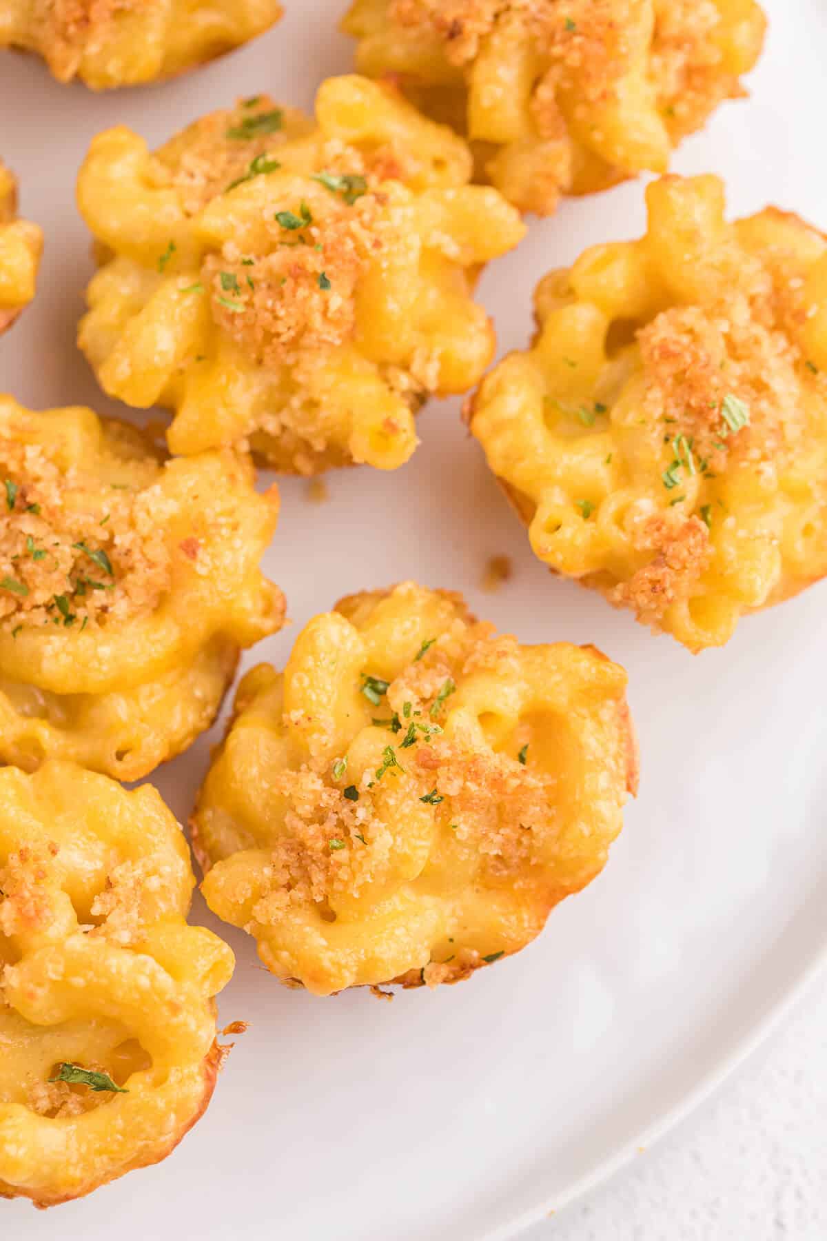 Mac and Cheese Cups - Comfort food in a cup! The perfect cozy, cheesy side dish, but handheld for appetizers and tailgating.