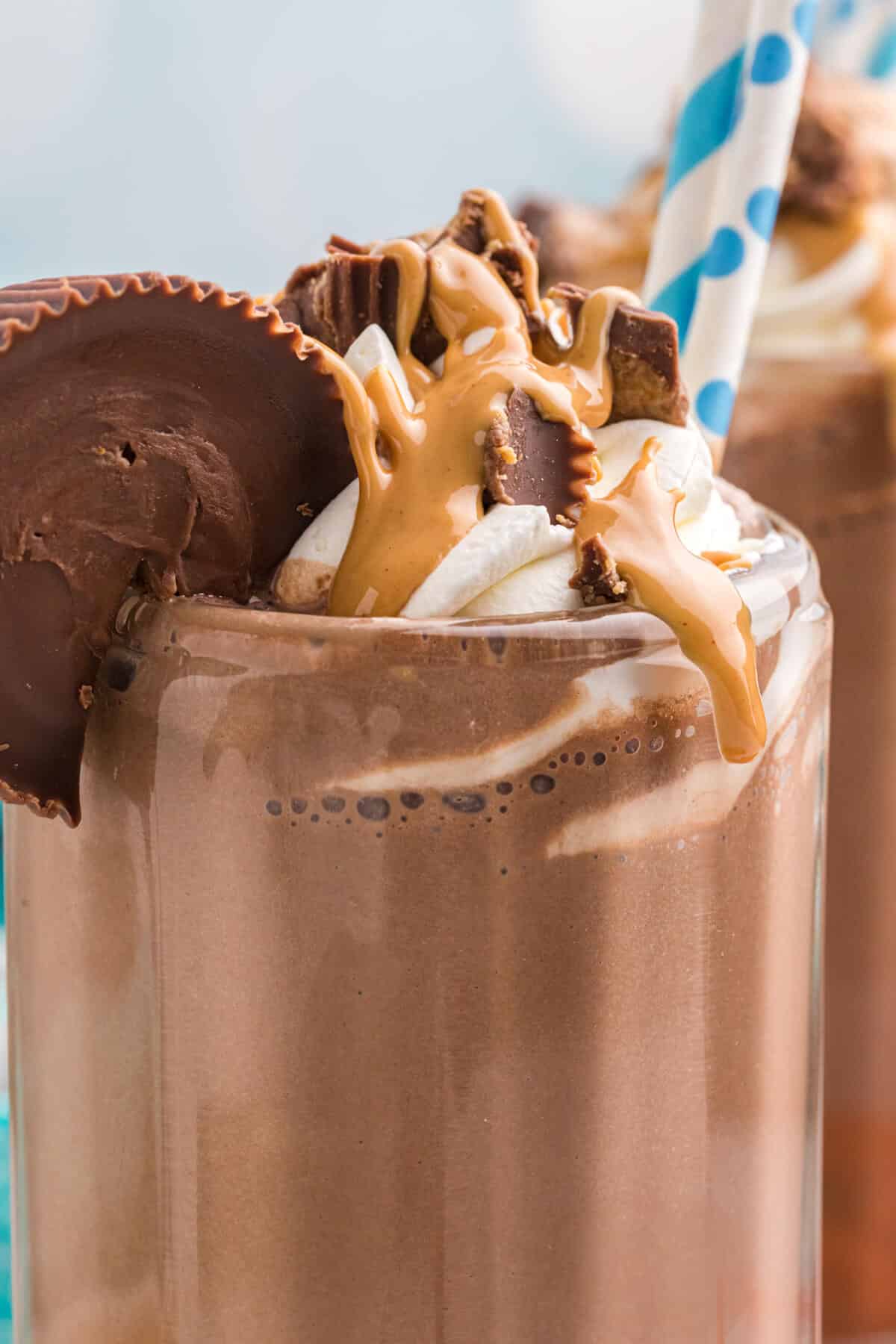 Reeses's coffee milkshake with a straw.