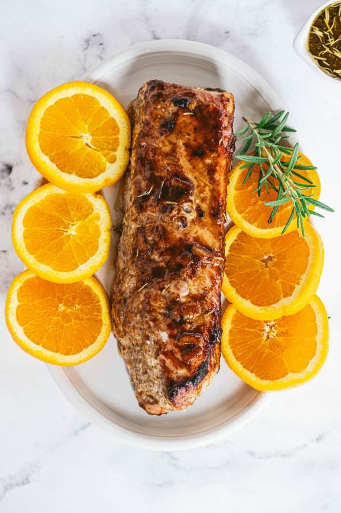 Orange Mustard Pork Tenderloin - This easy glazed tenderloin recipe is sweet and savory with orange juice and stone ground mustard. You'll never have a dry piece of pork with this homemade marinade.