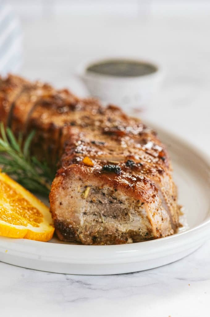 Orange Mustard Pork Tenderloin - This easy glazed tenderloin recipe is sweet and savory with orange juice and stone ground mustard. You'll never have a dry piece of pork with this homemade marinade.