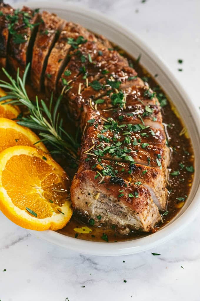 Orange Mustard Pork Tenderloin - This easy glazed tenderloin recipe is sweet and savory with orange juice and stone ground mustard. You'll never have a dry piece of pork with this homemade marinade.