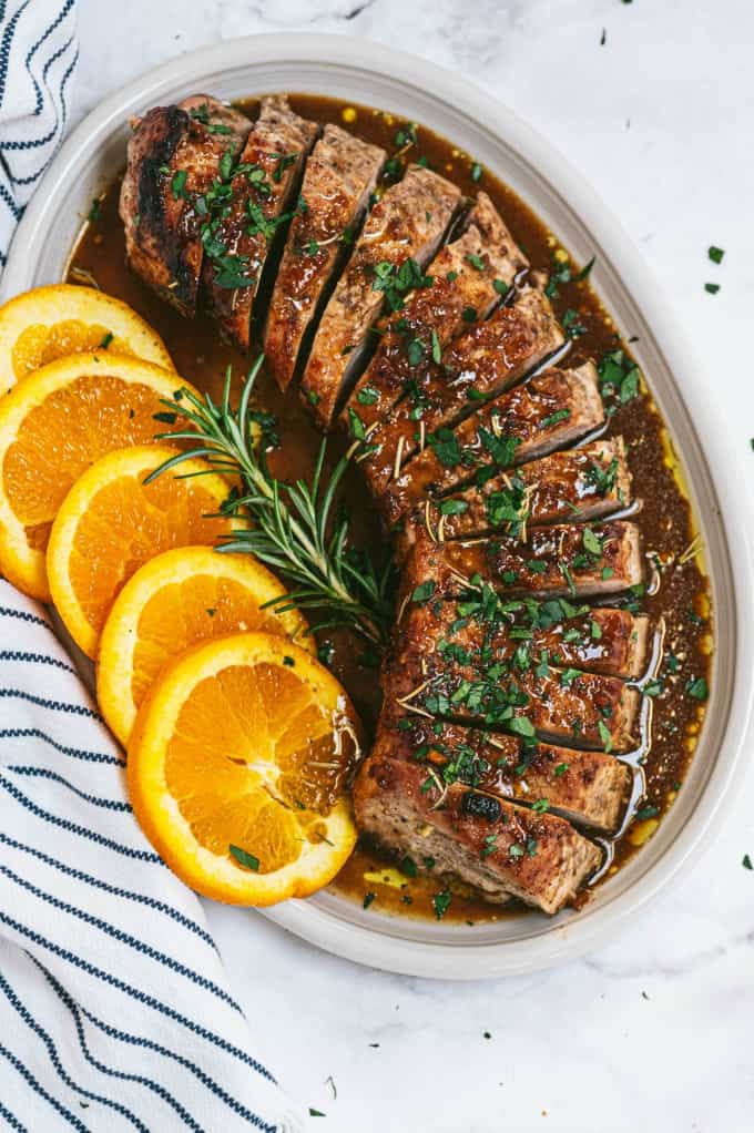 Orange Mustard Pork Tenderloin - This easy glazed tenderloin recipe is sweet and savory with orange juice and stone ground mustard. You'll never have a dry piece of pork with this homemade marinade.