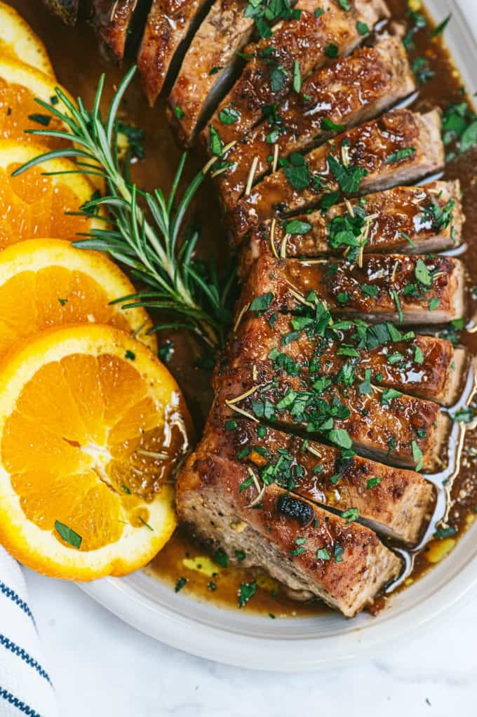 Orange Mustard Pork Tenderloin - This easy glazed tenderloin recipe is sweet and savory with orange juice and stone ground mustard. You'll never have a dry piece of pork with this homemade marinade.