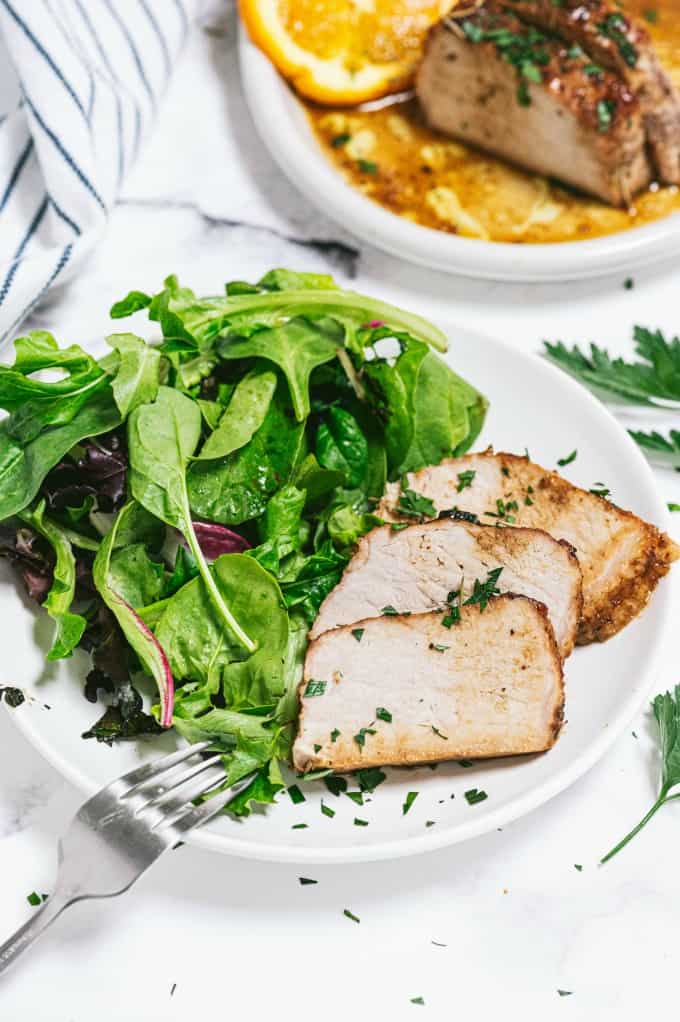 Orange Mustard Pork Tenderloin - This easy glazed tenderloin recipe is sweet and savory with orange juice and stone ground mustard. You'll never have a dry piece of pork with this homemade marinade.