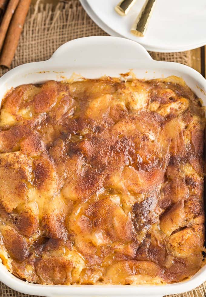 Apple Cinnamon Bun Breakfast Casserole - A sweet way to start your day and feed your guests! It's made with cinnamon buns + apple pie filling for a mouthwatering breakfast casserole you'll make again and again.