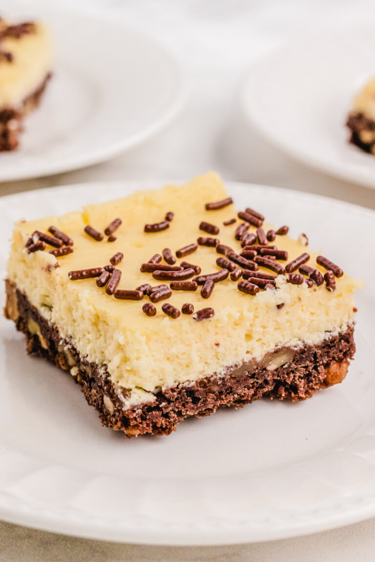 A cheesecake square on a plate.