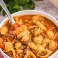 Hamburger soup in a bowl with a spoon.