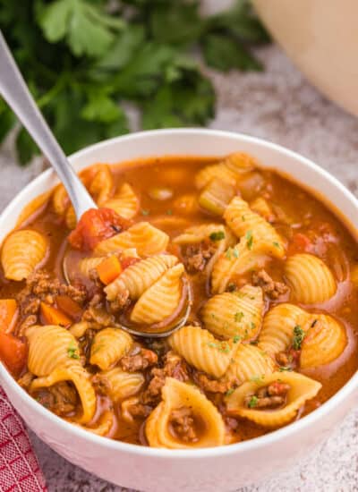 Hamburger soup in a bowl with a spoon.