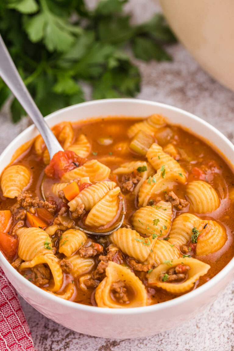 The soup in a bowl with a spoon.