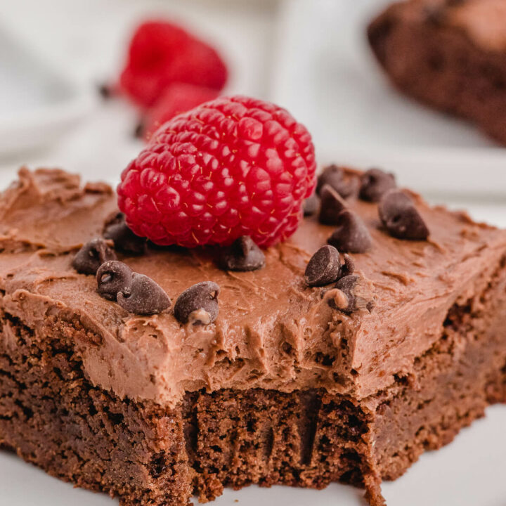 A chocolate raspberry brownie with a bite out of it.