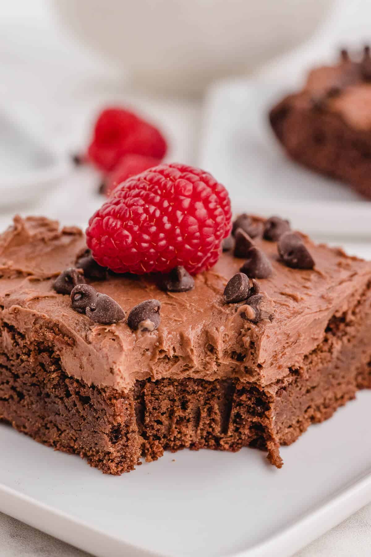 A chocolate raspberry brownie with a bite out of it.
