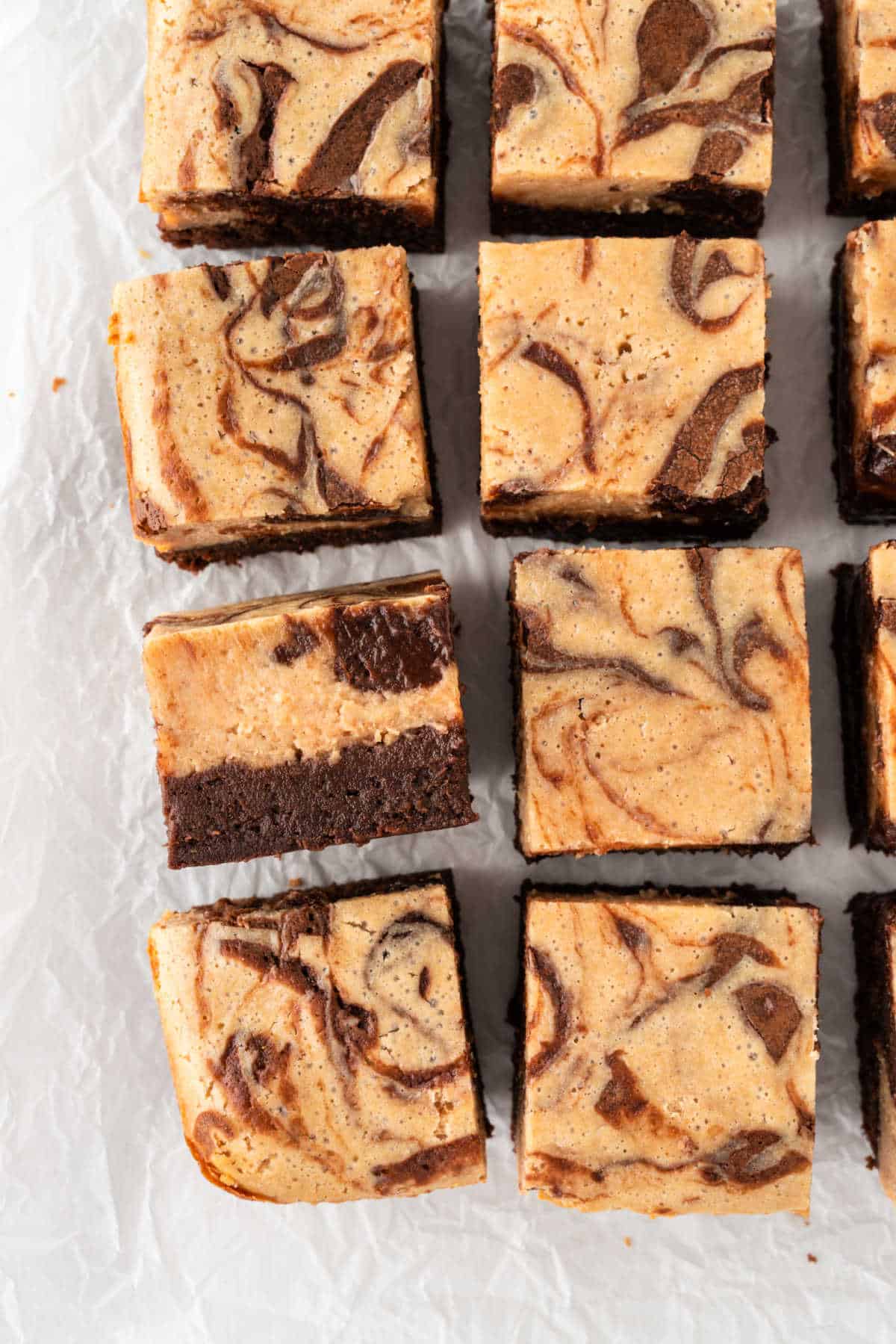 Peanut butter cheesecake brownies cut into squares.