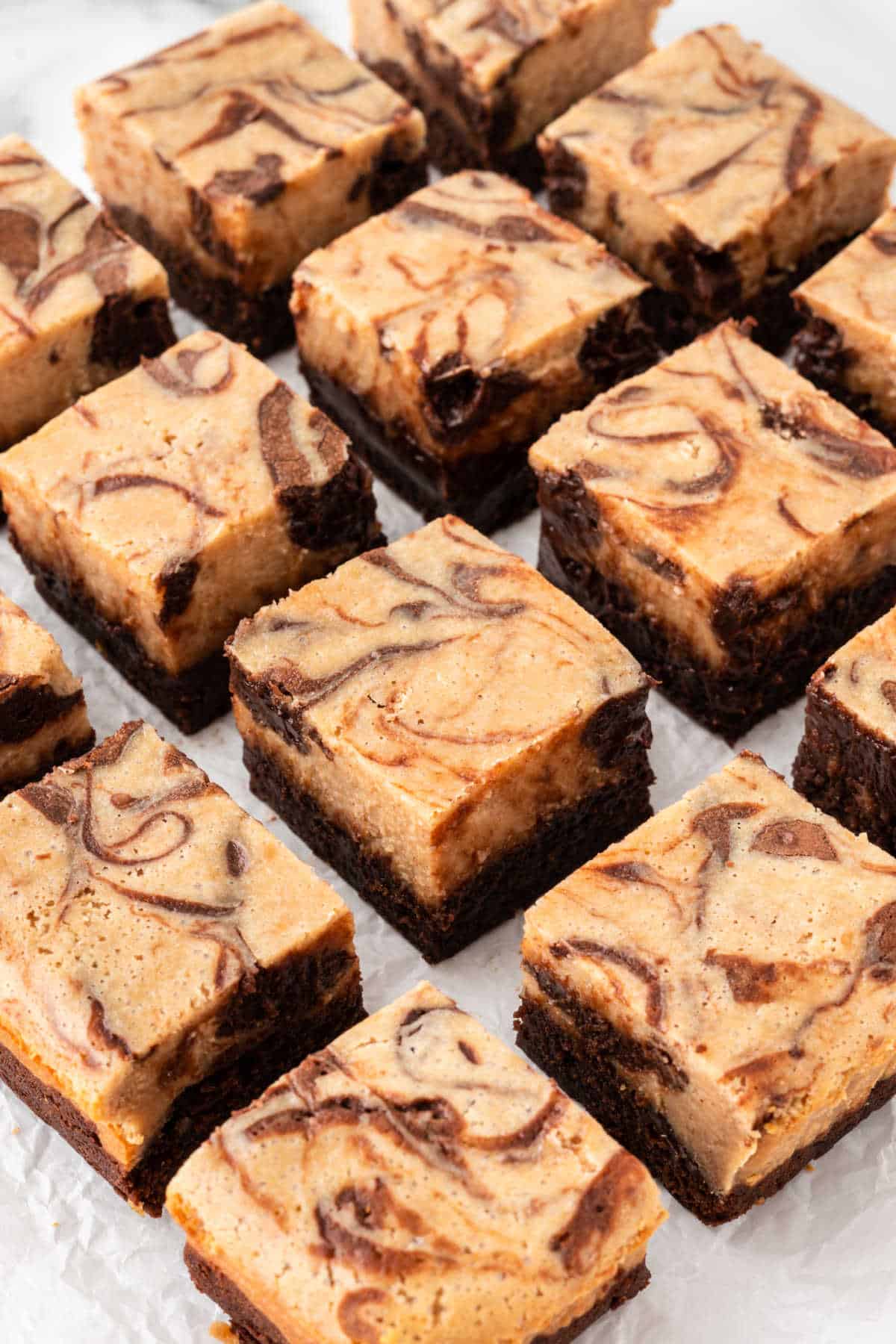 Peanut butter cheesecake brownies cut into bars.