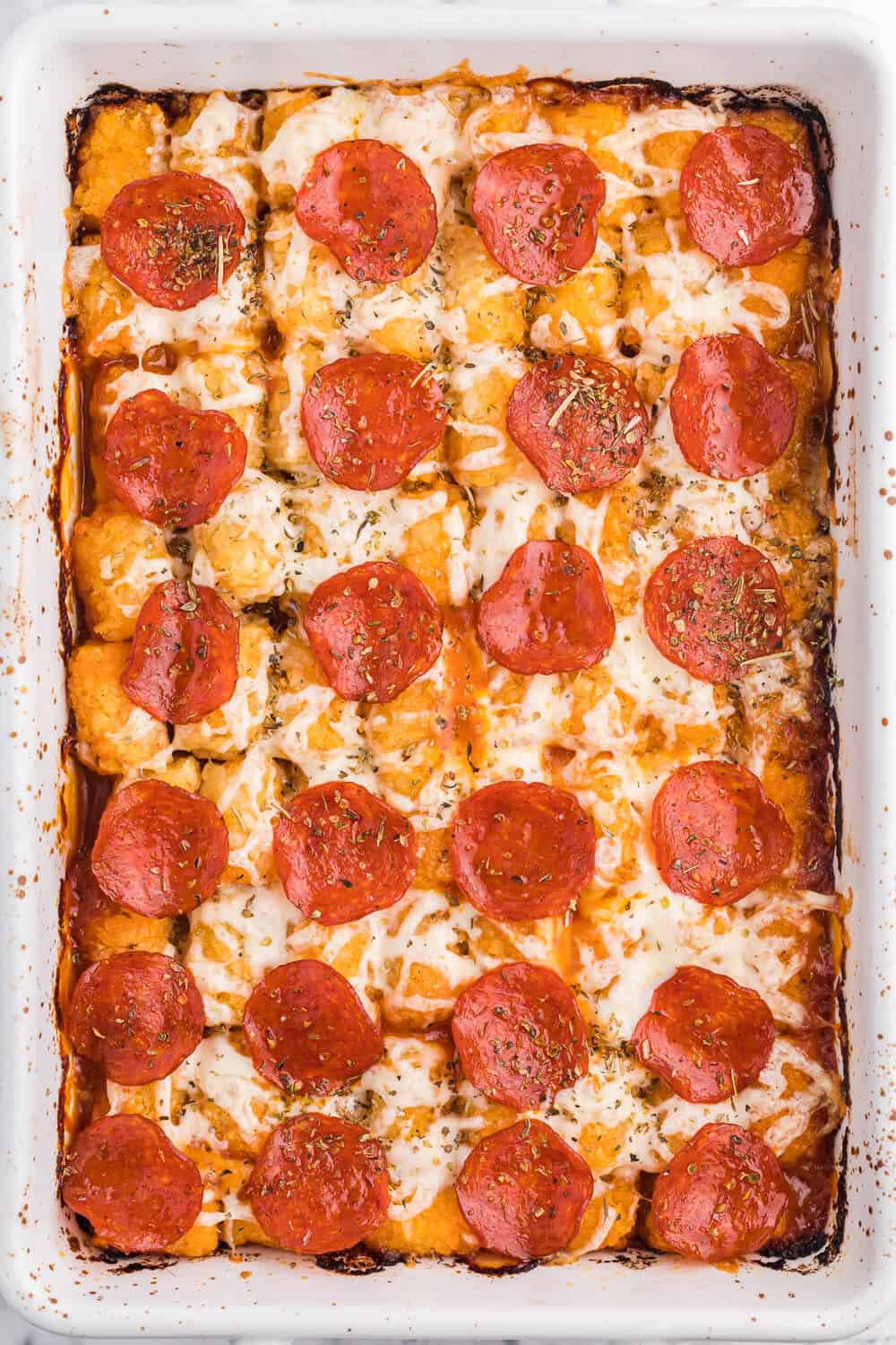 Pizza tater tot casserole in a casserole pan.