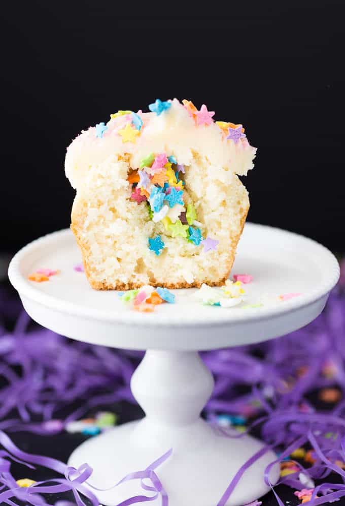 SING Inspired Cupcakes - Sweet vanilla cupcakes with a star surprise inside and topped with a smooth vanilla buttercream. Make a batch for your next family movie night to go with the movie, SING!