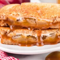 A caramel apple grilled cheese sandwich on a plate.