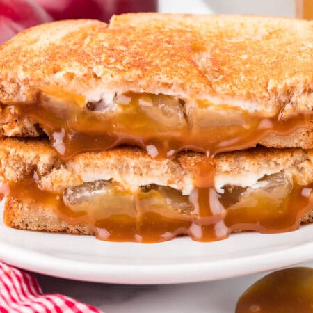 A caramel apple grilled cheese sandwich on a plate.