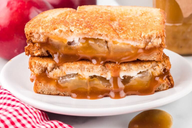 A caramel apple grilled cheese sandwich on a plate.