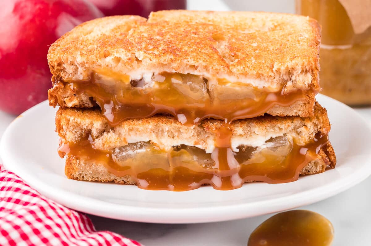 A caramel apple grilled cheese sandwich on a plate.