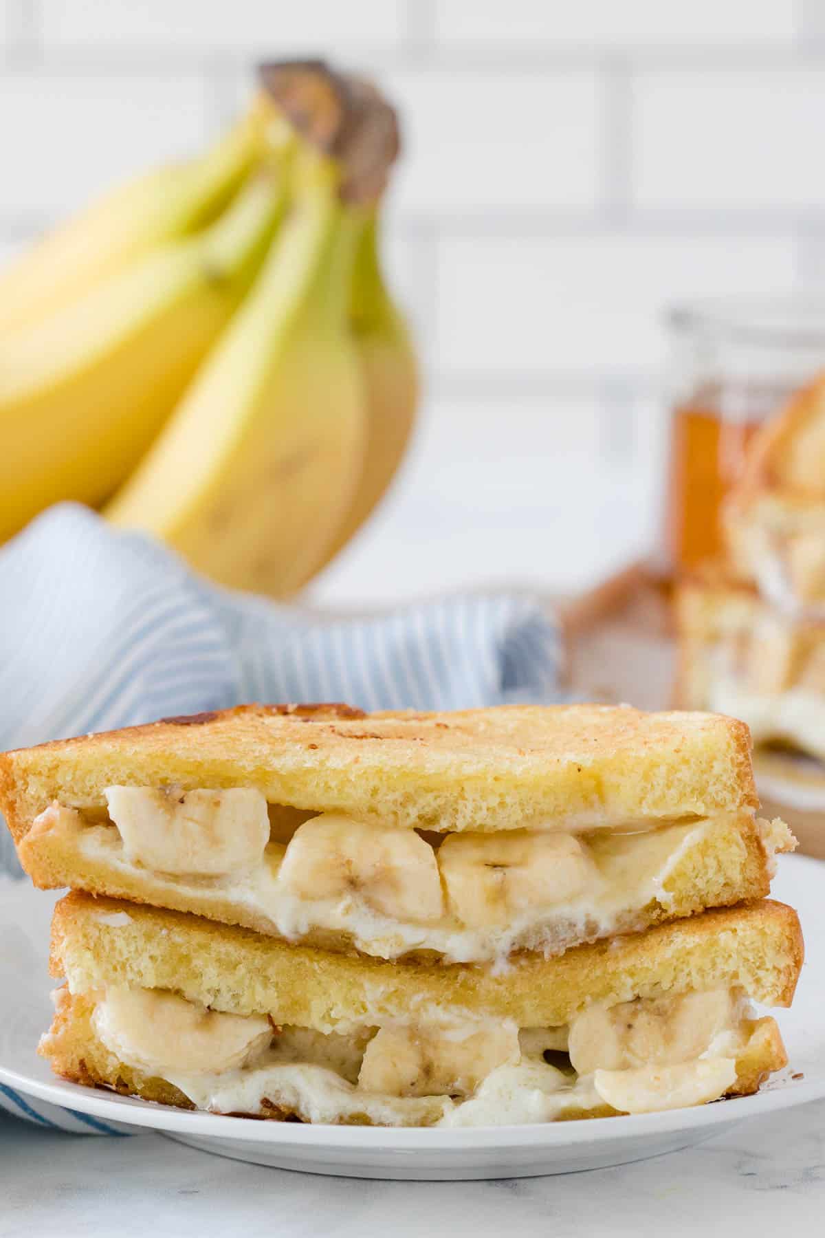 A honey banana grilled cheese sandwich on a plate.