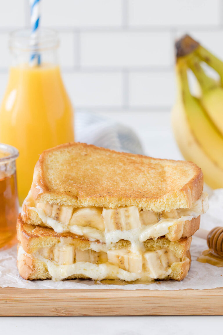 Honey Banana Grilled Cheese Stacked on a cutting board.