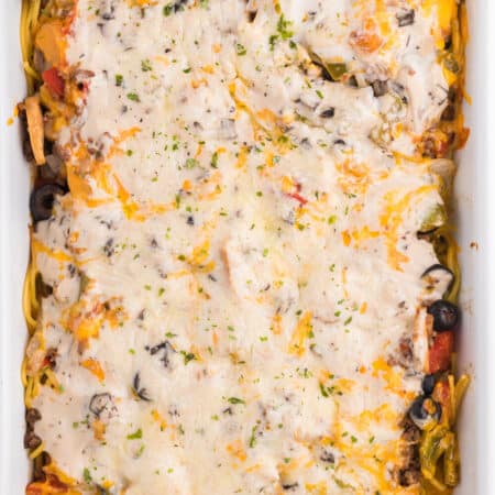 Spaghetti Casserole - Layered pasta, creamy mushroom sauce, diced tomatoes, mushrooms and olives are combined to make a perfect weekend supper.