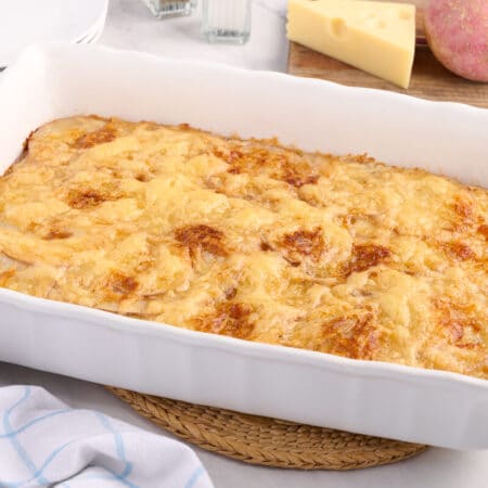 Swiss potatoes in a baking pan.